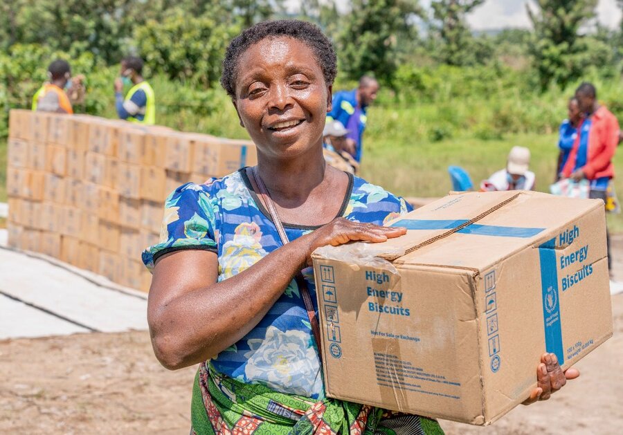 Sifa Akilimali lost children during deadly floods in northeastern DRC, but she's grateful for energy-packed biscuits delivered by UNHAS to hungry people. Photo: WFP/Benjamin Anguandia