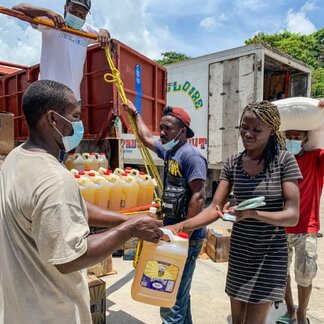 Woman receiving emergency food assistance distributed by WFP