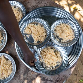 Plates of food, prepared for the school children and photographed from above, at the pre-school in Doba, Chad.